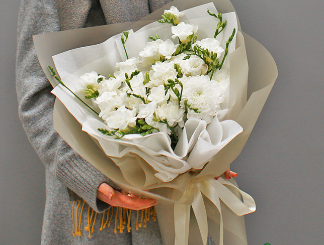 Bouquet of white freesias and chrysanthemums photo